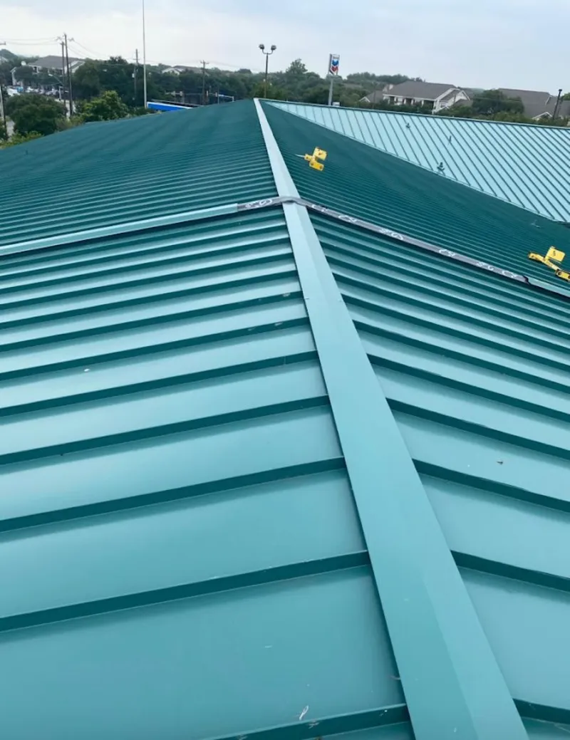 Green commercial metal roof ridge and valley for Metal Roof Repair in Addison